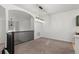 A well-lit dining area with black railings and modern chandelier at 10578 E Jewell Ave, Aurora, CO 80012