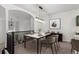 Upstairs dining area with modern chandelier and seating for four at 10578 E Jewell Ave, Aurora, CO 80012