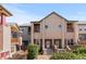 Inviting townhouse with stone accents, balconies, and well-maintained landscaping at 10578 E Jewell Ave, Aurora, CO 80012