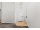Bright foyer with tile flooring and modern lighting fixture; ample natural light and neutral palette at 10578 E Jewell Ave, Aurora, CO 80012