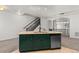 Open kitchen with stainless steel dishwasher and island with a double sink at 10578 E Jewell Ave, Aurora, CO 80012