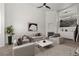 Well-lit living room features neutral tones, fireplace, and contemporary furnishings at 10578 E Jewell Ave, Aurora, CO 80012
