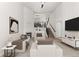 Bright living room with high ceilings, fireplace, and modern decor at 10578 E Jewell Ave, Aurora, CO 80012