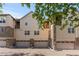 Exterior view of Townhomes showing three stories and attached garages at 10578 E Jewell Ave, Aurora, CO 80012