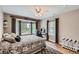 Cozy bedroom with large bay window, wood floors, and neutral paint at 19475 Stag Ln, Monument, CO 80132