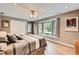 Comfortable bedroom with a bay window and wood floors; perfect for rest and relaxation at 19475 Stag Ln, Monument, CO 80132