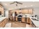 Bright kitchen with stainless steel appliances, wood cabinets, and stylish backsplash at 19475 Stag Ln, Monument, CO 80132