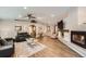 Spacious living room with hardwood floors, fireplace, natural light and open concept at 19475 Stag Ln, Monument, CO 80132