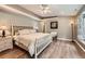 Spacious main bedroom features a tray ceiling, luxury vinyl flooring, and neutral color palette at 19475 Stag Ln, Monument, CO 80132