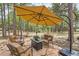 Inviting outdoor patio area with comfortable seating, perfect for relaxing and entertaining guests at 19475 Stag Ln, Monument, CO 80132
