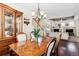 Open dining room with view into living room and fireplace at 10654 Ashfield St, Highlands Ranch, CO 80126