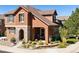 Inviting two-story home featuring a charming stone-accented entry and well-maintained landscaping at 10654 Ashfield St, Highlands Ranch, CO 80126