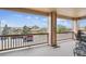 A covered balcony provides beautiful views of the surrounding neighborhood and clear skies at 7131 S Wenatchee Way # F, Aurora, CO 80016