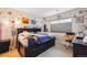Comfortable bedroom with natural light from a window and lots of personalized touches and decorations at 7131 S Wenatchee Way # F, Aurora, CO 80016