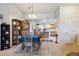 Dining area adjacent to the kitchen, features a table with blue tablecloth and display shelves at 7131 S Wenatchee Way # F, Aurora, CO 80016