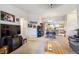 Open-concept space with living area flowing into dining area and kitchen, great for entertaining at 7131 S Wenatchee Way # F, Aurora, CO 80016