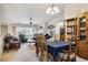 Open-concept living and dining area with fireplace, perfect for gatherings and daily living at 7131 S Wenatchee Way # F, Aurora, CO 80016