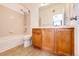 Well-lit bathroom with neutral tile, bathtub, and vanity at 15955 E Geddes Dr # 55, Aurora, CO 80016