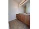 Bathroom featuring a double vanity with a large mirror and tiled floors for added convenience at 15955 E Geddes Dr # 55, Aurora, CO 80016