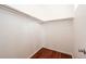 Large walk-in closet with laminate wood floor and clothes rod at 15955 E Geddes Dr # 55, Aurora, CO 80016