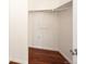 Walk-in closet with wood-look flooring and ample storage space, offering functionality and organization at 15955 E Geddes Dr # 55, Aurora, CO 80016