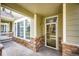 Charming front porch features stone detailing and a view of the well-maintained walkway at 15955 E Geddes Dr # 55, Aurora, CO 80016