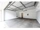 Spacious two car garage with a concrete floor and interior access at 15955 E Geddes Dr # 55, Aurora, CO 80016
