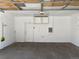 Clean garage with shelves and organization system with freshly painted walls and sealed concrete flooring at 15955 E Geddes Dr # 55, Aurora, CO 80016