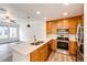 Bright kitchen boasts stainless steel appliances, double sinks, and ample counter space at 15955 E Geddes Dr # 55, Aurora, CO 80016
