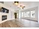 Inviting living room with fireplace, large windows, and built-in shelving at 15955 E Geddes Dr # 55, Aurora, CO 80016