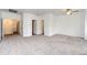 Expansive living room featuring plush carpeting and multiple entryways, perfect for entertaining at 15955 E Geddes Dr # 55, Aurora, CO 80016