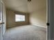 Neutral bedroom with window and plush carpet, offering a relaxing and comfortable space, perfect for unwinding at 4519 S Atchison Way, Aurora, CO 80015