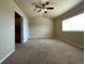 Spacious bedroom with large window, carpeted floors, vaulted ceiling, and walk-in closet at 4519 S Atchison Way, Aurora, CO 80015