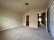 Spacious bedroom with walk in closet, neutral walls, and plush carpet at 4519 S Atchison Way, Aurora, CO 80015