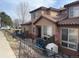 Charming townhome featuring a terracotta tile roof, cozy patio, and a well-maintained exterior, creating inviting curb appeal at 4519 S Atchison Way, Aurora, CO 80015