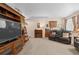 Spacious basement featuring a fireplace, TV, comfortable seating and wet bar at 1410 Exquisite St, Castle Rock, CO 80109