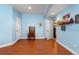 A finished basement featuring wood-look floors, storage space, and open access to other rooms at 1410 Exquisite St, Castle Rock, CO 80109