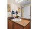 A charming bathroom featuring a single sink with a decorative mirror and neutral wall color at 1410 Exquisite St, Castle Rock, CO 80109