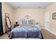 A simple bedroom with nice lamps on either side of the bed at 1410 Exquisite St, Castle Rock, CO 80109