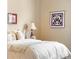 This bedroom features a cozy atmosphere with a quilt and soft lighting at 1410 Exquisite St, Castle Rock, CO 80109