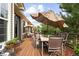 Large outdoor deck with a dining table and chairs, ideal for enjoying meals outdoors with wooded views at 1410 Exquisite St, Castle Rock, CO 80109