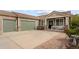 Charming exterior of the home featuring a spacious driveway and three-car garage at 1410 Exquisite St, Castle Rock, CO 80109