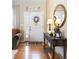 Bright foyer with hardwood floors, decorative mirror, and an abundance of natural light at 1410 Exquisite St, Castle Rock, CO 80109