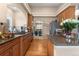Spacious kitchen with granite countertops, stainless steel appliances, and wood floors at 1410 Exquisite St, Castle Rock, CO 80109
