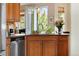Gourmet kitchen sink area with stainless steel appliances and view to outside patio at 1410 Exquisite St, Castle Rock, CO 80109