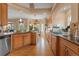 Well-equipped kitchen with stainless steel appliances, ample cabinet space, and wood flooring at 1410 Exquisite St, Castle Rock, CO 80109