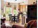 Cozy kitchen nook with hardwood floors, breakfast table and natural light from large windows at 1410 Exquisite St, Castle Rock, CO 80109