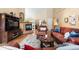 Inviting living room featuring a fireplace, hardwood floors, and comfortable furnishings at 1410 Exquisite St, Castle Rock, CO 80109