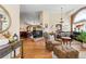 Spacious living room featuring a fireplace, hardwood floors, and elegant decor at 1410 Exquisite St, Castle Rock, CO 80109