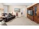 Comfortable living room with leather seating, a TV, and warm ambient lighting at 1410 Exquisite St, Castle Rock, CO 80109